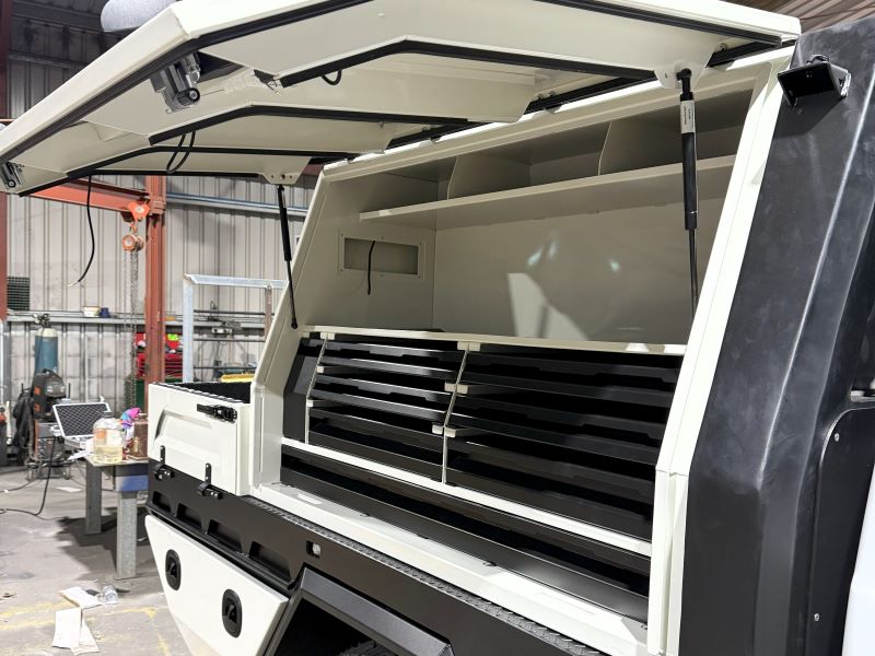 Heavy-duty aluminium toolbox fitted to a Freedom Fabrication tray for secure storage.